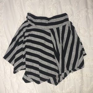 Handkerchief hem silver and black striped skirt.